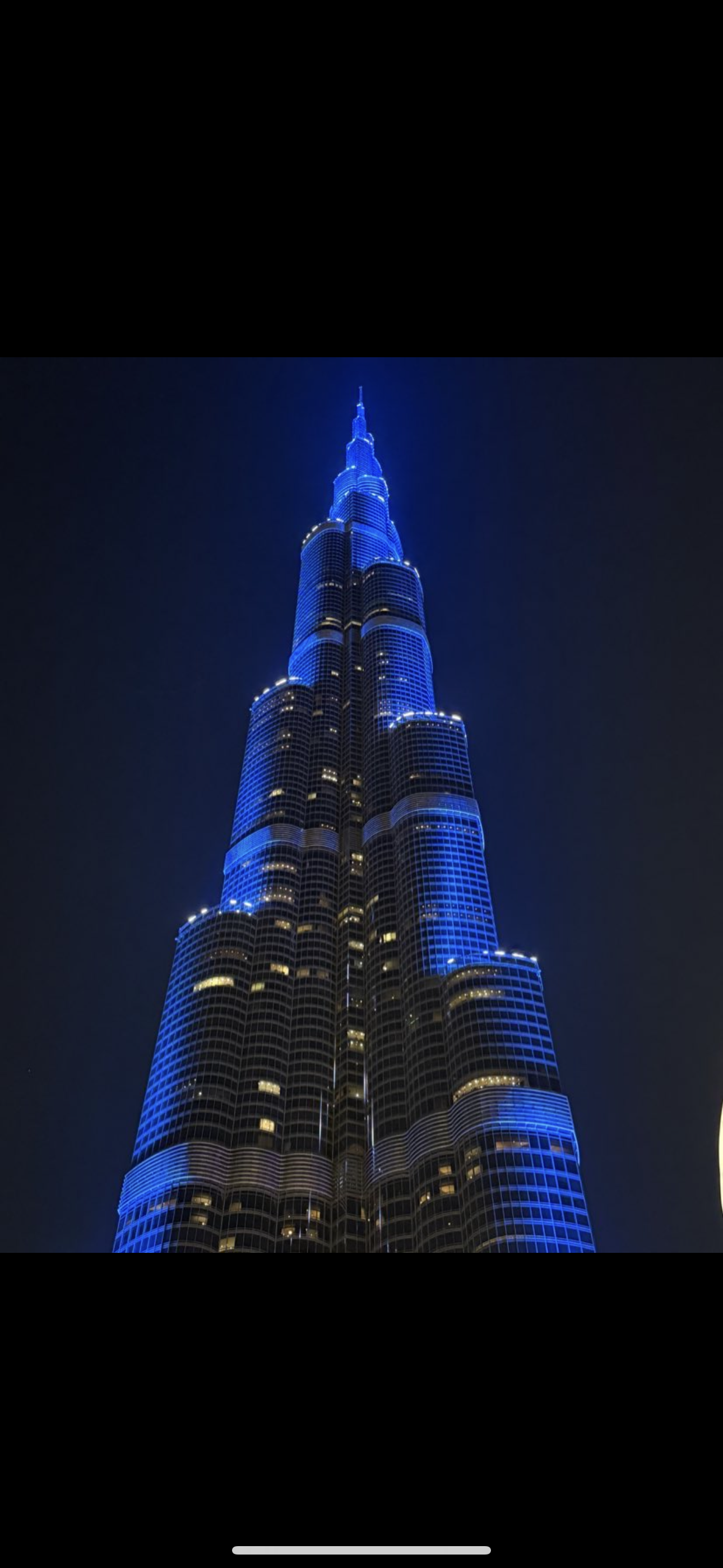 Burj Khalifa lit blue at night